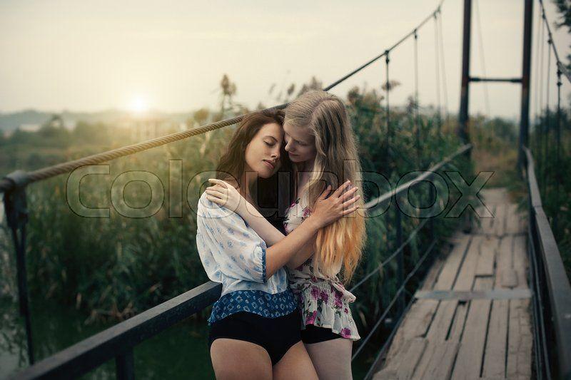 Girls in lesbian embrace